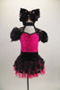 Dress with mini sequined hot pink bust has Queen Anne neckline with  black sequined upper, pouf sleeves & open back. Matching skirt has polka dot overlay. Comes with large black sequined hair bow. Front