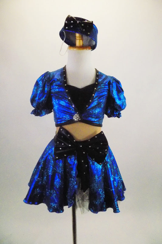 Black & blue 2-piece costume has black bust, nude mesh torso & attached blue skirt with bow at front. Comes with pouf sleeved bolero jacket & crystal button. Front