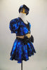Black & blue 2-piece costume has black bust, nude mesh torso & attached blue skirt with bow at front. Comes with pouf sleeved bolero jacket & crystal button. Right side