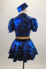 Black & blue 2-piece costume has black bust, nude mesh torso & attached blue skirt with bow at front. Comes with pouf sleeved bolero jacket & crystal button. Back