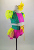 2-piece pink & green costume has bright yellow polka dot layered back bustle & pouf sleeves. Waistband has bright yellow lace up ribbon. Has daisy hair clip. Right side