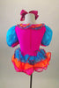 Bright pink clown themed leotard dress has turquoise pouf sleeves, neck ruffles & buttons. Skirt is layers of turquoise orange & pink sequined ruffles. Comes with hair bow. Back