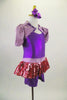 Purple short leotard has attached pink sequined short skirt with lavender waistband. The accompanying lavender shrug has pouf sleeves & crystaled purple piping. Comes with purple hair accessory. Side