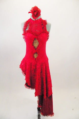 Red sequined lace dress has long angled satin & lace skirt that extend down the left side. Torso has nude mesh peek-a-boo holes & ruffled neck & straps. Comes with rose hair accessory. Front