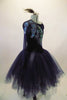 Stunning navy blue velvet full romantic tutu has one shoulder long sleeved bodice accented with 3-D lace of blue floral & green-silver peacock tail feathers. Comes with hair accessory. Right side