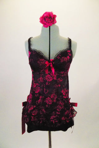 Black & fuchsia rose lace, bones baby-doll corset is paired with black shorts. The corset has padded cup bra (B), lace ruffle & ribbon accents. Comes with floral hair accessory. Front