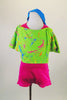 Hot pink halter neck short unitard comes with bright green short sweatshirt cover with bright paint splatter print. Comes with matching turquoise leg warmers. Front