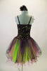 Magenta purple based dress has black lace overlay with lime green sequins & feather accent at right shoulder. The tulle skirt is layers of lime magenta & black. Comes with matching feather hair accessory. Back