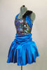 Blue satiny dress has fully sequined front bodice surrounded by halter ties, & black back. Gathered skirt has layered crinoline & cummerbund waistband. Comes with crystal hair barrette. Side