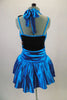 Blue satiny dress has fully sequined front bodice surrounded by halter ties, & black back. Gathered skirt has layered crinoline & cummerbund waistband. Comes with crystal hair barrette. Back