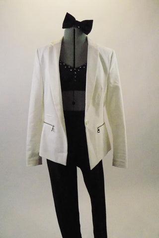 Denim leggings are paired with matching padded crystalled bra, accompanied by a white lined blazer with lapels and zippered pockets. Comes with Large blue bow. Front