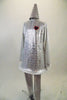 Tin-man themed long sleeved silver sequined tunic dress has hoop bottom and heart applique. The costume comes with silver leggings and a sequined cone hat. Side