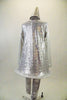Tin-man themed long sleeved silver sequined tunic dress has hoop bottom and heart applique. The costume comes with silver leggings and a sequined cone hat. Back