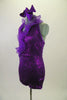 Purple sequined lace short unitard has a halter neck & curly ruffled organza cascading down the front. Right sleeve is full length purple stretch mesh. Comes with matching hair accessory. Left side
