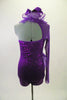 Purple sequined lace short unitard has a halter neck & curly ruffled organza cascading down the front. Right sleeve is full length purple stretch mesh. Comes with matching hair accessory. Back