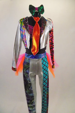 3-piece wild, bright costume with silver leggings & jacket has bright bold patterned inlays on legs, arms & lapels. Legging has pink-orange tutu bustle skirt. Comes with bright orange neck tie & green hair bow. Front
