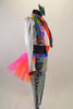 3-piece wild, bright costume with silver leggings & jacket has bright bold patterned inlays on legs, arms & lapels. Legging has pink-orange tutu bustle skirt. Comes with bright orange neck tie & green hair bow. Right side