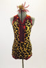 Leopard print halter leotard has V-neck front and keyhole back. The edging and center front are bright red metallic. Comes with matching hair accessory. Front