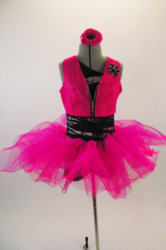 3-piece costume has black & silver striped, one shoulder unitard base. The base is paired with pink bengaline vest. Has pink, crystal tulle pull-on tutu skirt & floral hair accessory. Front