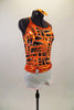 Black & orange abstract lattice print camisole leotard has white bottom. White cotton short sits over top of the leotard & has a bright orange hooped belt. Comes with matching hair accessory. Side