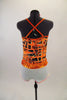 Black & orange abstract lattice print camisole leotard has white bottom. White cotton short sits over top of the leotard & has a bright orange hooped belt. Comes with matching hair accessory. Back