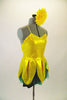 2-piece costume comes with dark green shorts &  yellow flower themed camisole dress with petals & a soft green underlay. Has yellow gerbera daisy hair clip. Side