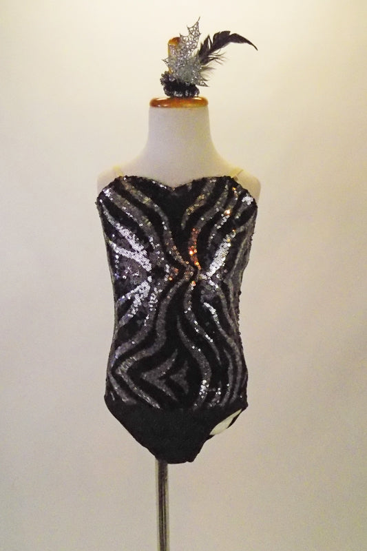 Black & silver sequined-front leotard has zebra-style print with black bottom and nude straps. Comes with matching hair accessory. Front