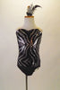 Black & silver sequined-front leotard has zebra-style print with black bottom and nude straps. Comes with matching hair accessory. Front