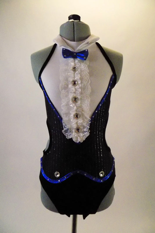 Classic Fosse-inspired open back and sides with double banded back strap. The costumes pops with blue piping, pin-striped coat-tail accents and ruffled bid with jewelled buttons and peaked lapel collar. The costume comes with a black tall bowler hat and matching jewel accented wrist cuffs. Front