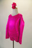 Long sleeved hot pink metallic marbled short unitard has crystalled front and back accents. The open back has a fully crystalled bow that rests at the base of the lower back. Comes with a hair accessory. Side