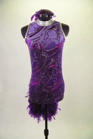 Lavender high-necked leotard has silver, purple and magenta swirls and silver collar. The back has a keyhole opening and large purple boa feather bustle. Comes with matching gauntlets and feather hair accessory. Front