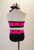 Two-piece costume has a pink halter half top with black polka dots, sequined band and fringed collar. The matching black brief has polka dot waistband. Comes with large pink polka dot hair bow. Back