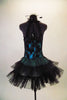 Teal based leotard dress has black laced, overlay bodice with pinch front. The halter collar has wide back straps emerging from the back collar. The layered ruffle black tulle skirt gives the costume volume and a balletic touch. Comes with matching black feather hair accessory. Back