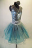 Sparking silver tutu dress has sleeveless sequined bodice with V-front and keyhole back. The attached turquoise and silver tulle skirt with silver cummerbund balances the sparkly bodice. Comes with hair accessory. Side