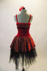 Spanish themed costume has red velvet torso with red and gold glitter brocade design at bust and skirt overlay. The soft black tulle romantic skirt sits below revealing the lines of the leg. Comes with red rose hair accessory. Back