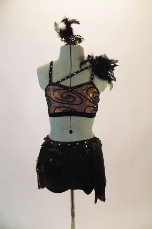 2-piece costume has an antique gold half top with black velvet swirls. There is a diagonal crystalled strap the rests on the chest between the two shoulder straps with a feather accent at the left shoulder. The accompanying black velvet shorts have lace and crystal accented wide waistband with cascading scarf belt Comes with antique gold and feather hair accessory. Front
