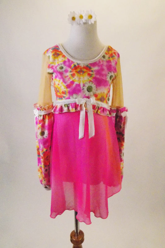 Sweet flower power inspired dress has a floral bodice and bishop sleeves accented with white ribbon. The attached soft chiffon skirt in shades of deep pinks with a hint of orange. Comes with matching floral hair accessory. Front