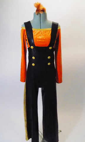 Two- piece costume has black leatherette pants with a wide leg and gold side stripe, has attached suspenders and gold front button accents. The long-sleeved, scoop neck orange velvet half-top has gold neckline to compliment the gold heart pattern. Comes with a hair accessory. Front