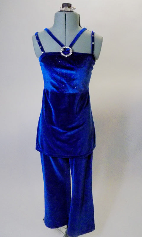 Two piece costume features a blue velvet camisole, open back tunic top with crystal buckle accent and cross front straps. Comes with matching blue velvet pants and hair accessory. Front