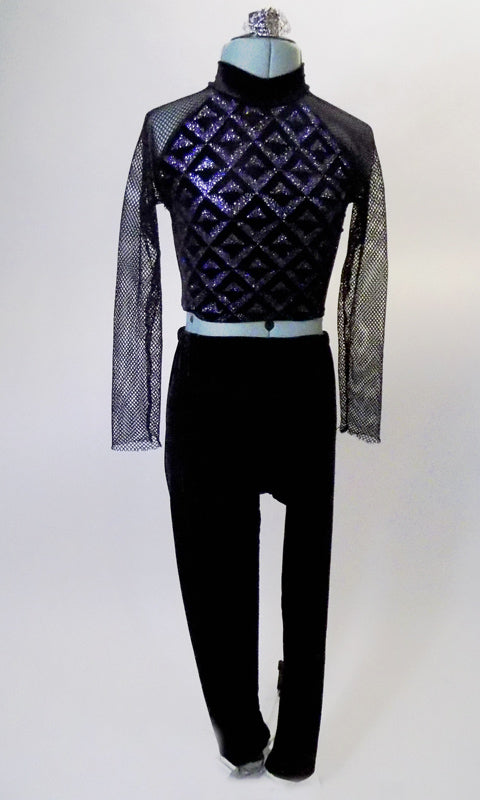This modern two-piece costume has black velvet pant is paired with a silver and black high neck, geometric print half top with long fishnet sleeves and open back. Comes with a silver hair accessory. Front