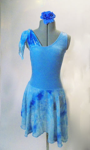 Blue velvet dress has one shoulder tank style with marbled crinkle chiffon tie-up on the other shoulder. The skirt is matching crinkle chiffon with attached brief below. Comes with a hair accessory. Front