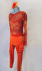This two-piece is bright orange textured capri pants with gold undertone has large red-sequined pockets on left hip and right thigh. The matching long sleeved top is a large mesh net in marbled shades of orange and red with scattered gold fleck throughout. Comes with red bra and hair accessory. Left side