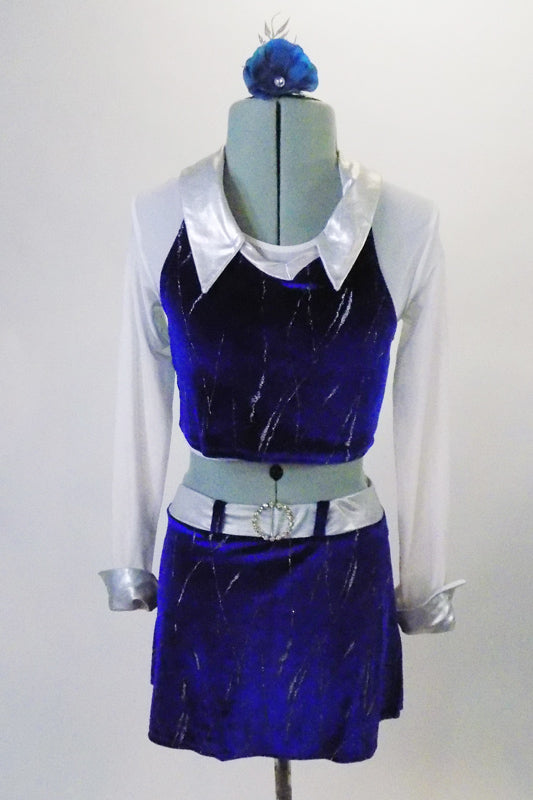 2-piece blue velvet and silver costume has a skirt with silver belt, crystal buckle, side slits and a built-in brief. The top has white shimmery mesh long sleeves, silver collar and blue velvet overlay. Comes with a hair accessory. Front