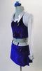 2-piece blue velvet and silver costume has a skirt with silver belt, crystal buckle, side slits and a built-in brief. The top has white shimmery mesh long sleeves, silver collar and blue velvet overlay. Comes with a hair accessory. Side
