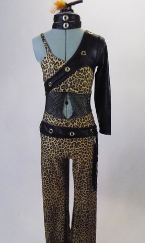 Leopard print camisole unitard has single sleeved, black leatherette left shoulder shrug with metal grommets and matching leatherette belt choker. The midriff is mesh, with a center peek-a-boo hole. Comes with mesh gauntlet and hair accessory. Front