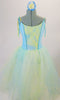 Romantic tutu dress has a pale blue bodice with blue and yellow lace front panel accented with sequined ruffle. The full tulle skirt has layers of pale blue, green and yellow for a soft pleasant flowy look. Comes with matching floral hair accessory. Front