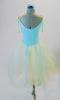 Romantic tutu dress has a pale blue bodice with blue and yellow lace front panel accented with sequined ruffle. The full tulle skirt has layers of pale blue, green and yellow for a soft pleasant flowy look. Comes with matching floral hair accessory.  Back