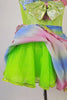 Iridescent dress has pale green bodice with rainbow coloured ruffles around the neckline and matching skirt. The neon green petticoat gives the skirt a nice fullness.  Comes with matching ruffled armband floral hair accessory. Skirt petticoat