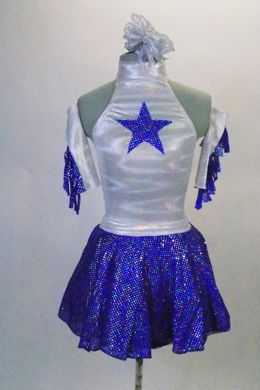 Cowboy themed, silver and blue dress has a halter-necked silver leotard with a blue sequined star at front. The blue sequined pull-on skirt has attached petticoat for fullness. Comes with matching blue fringed silver armbands and silver hair accessory. Front