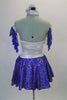 Cowboy themed, silver and blue dress has a halter-necked silver leotard with a blue sequined star at front. The blue sequined pull-on skirt has attached petticoat for fullness. Comes with matching blue fringed silver armbands and silver hair accessory. Back